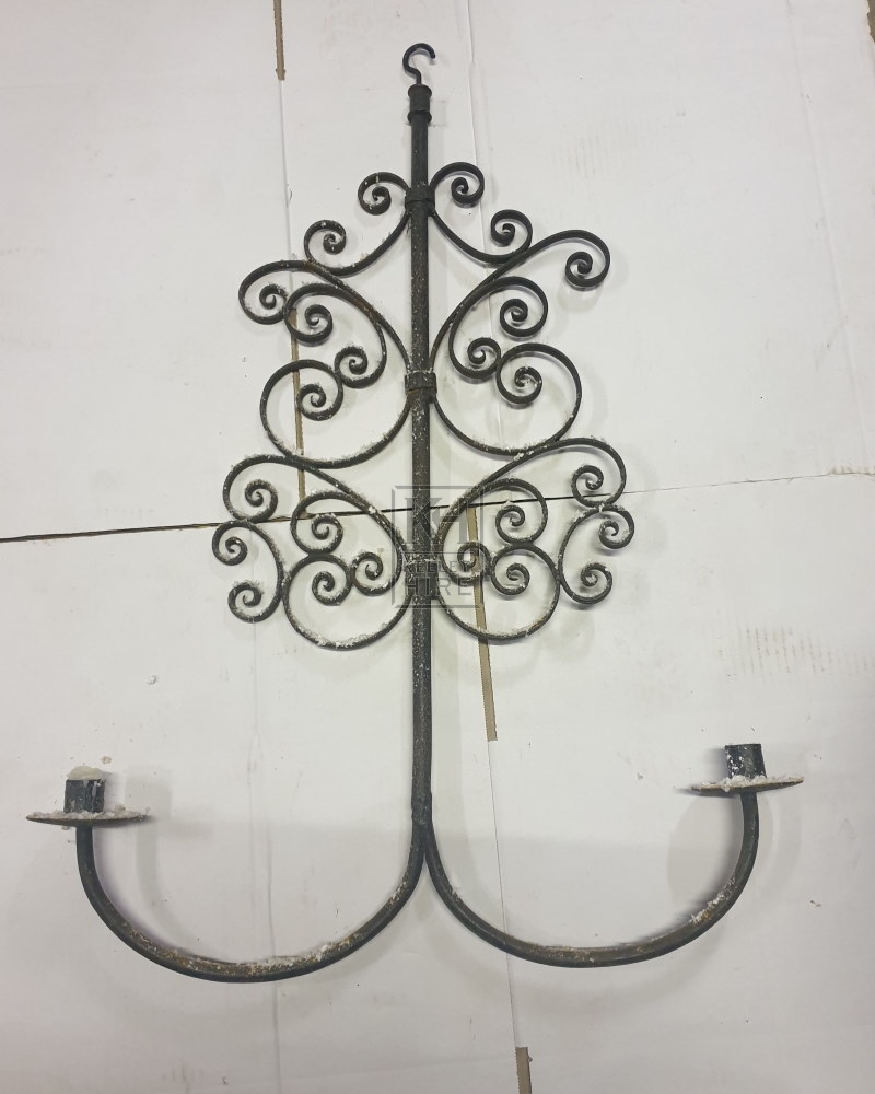 Hanging ornate iron candleholder