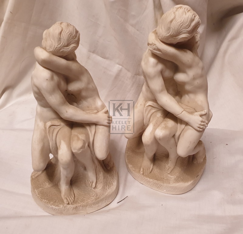 Plaster kissing figurines