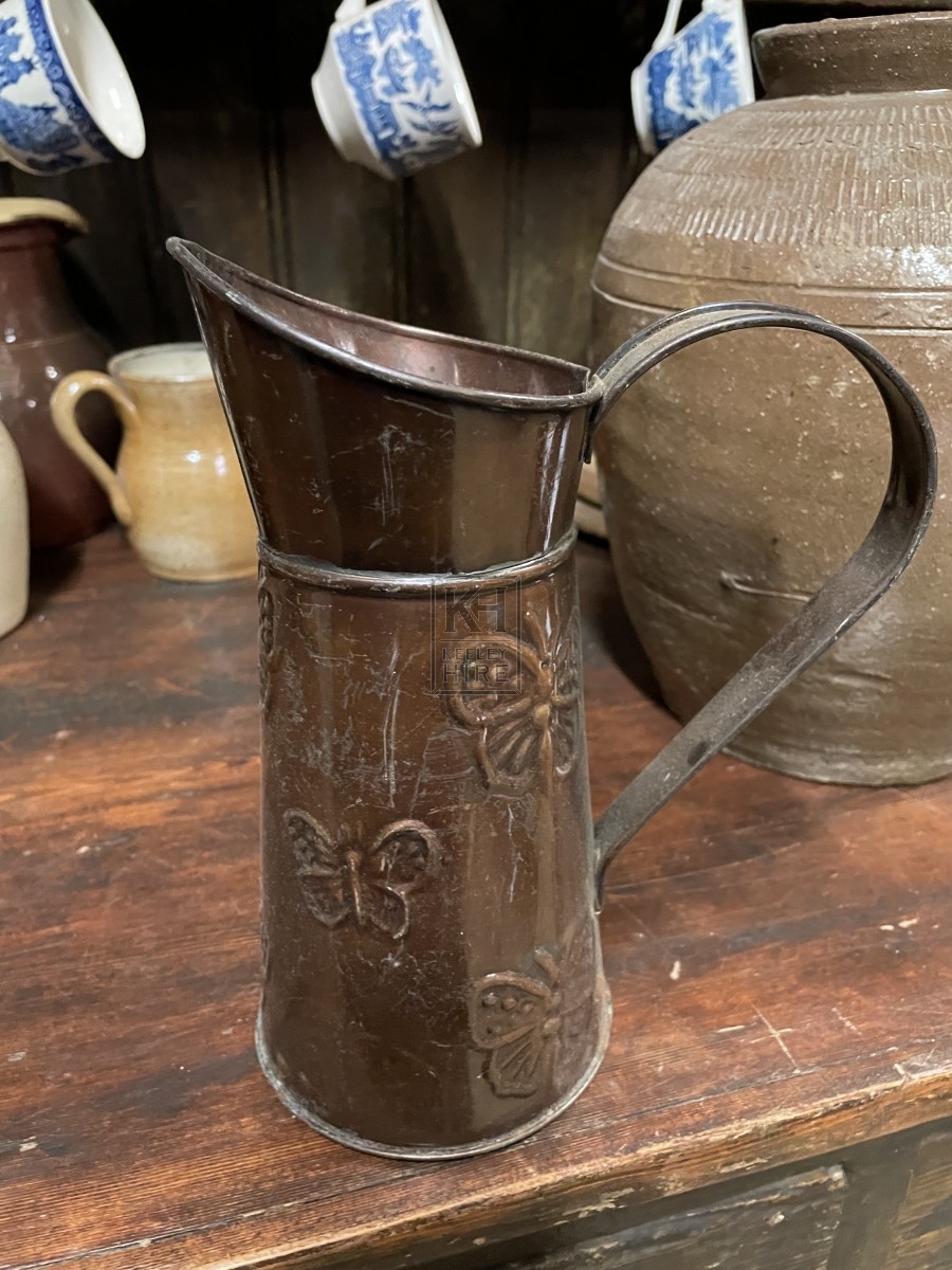 Copper Jug With Butterfly Pattern