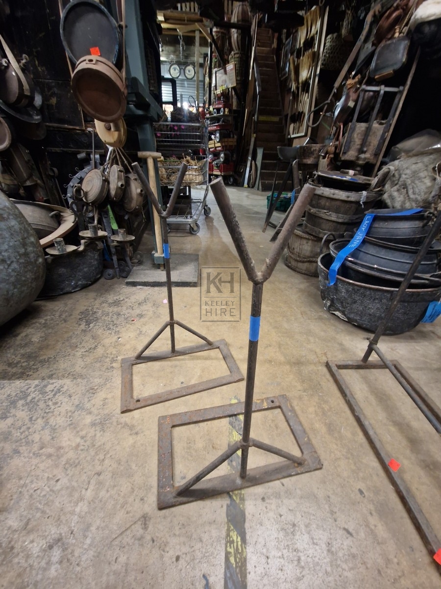 Pair of iron uprights on base