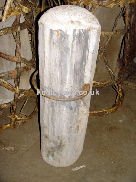Heavy rough wood post with iron bar