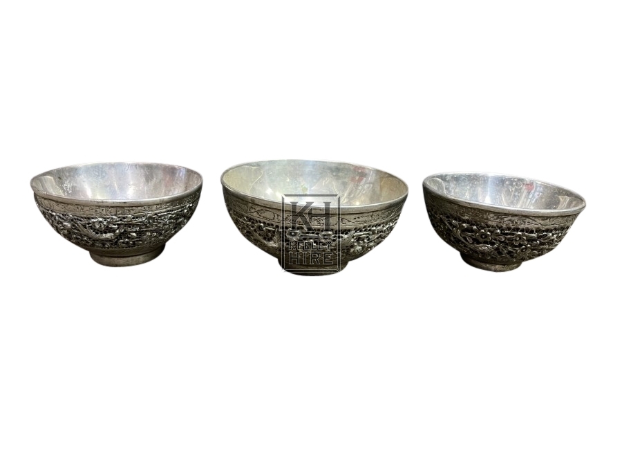 Small ornate silver bowls