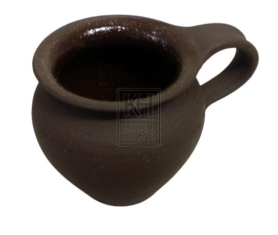 Small dark brown pottery tankard