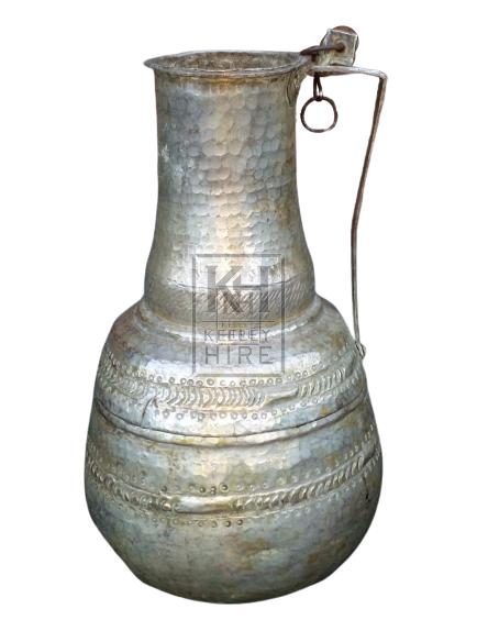 Beaten silver jug with straight handle