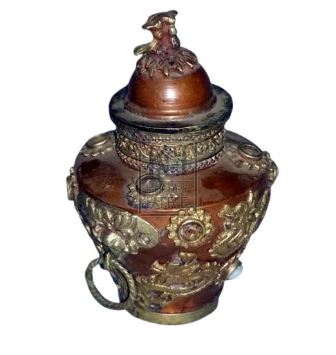 Ornate copper urn with lid