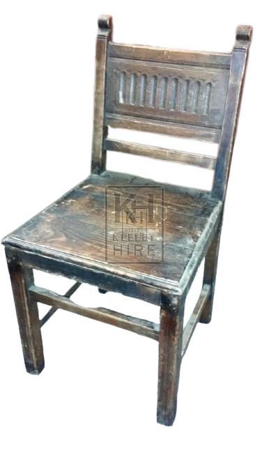 Carved back dark wood chair