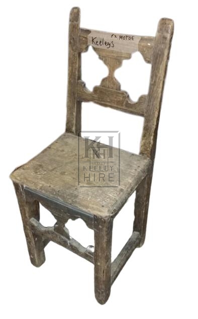 Worn carved wood chair