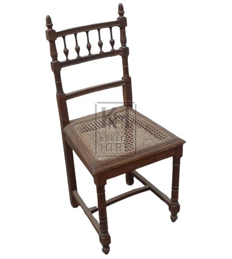 Carved wood chair with woven seat