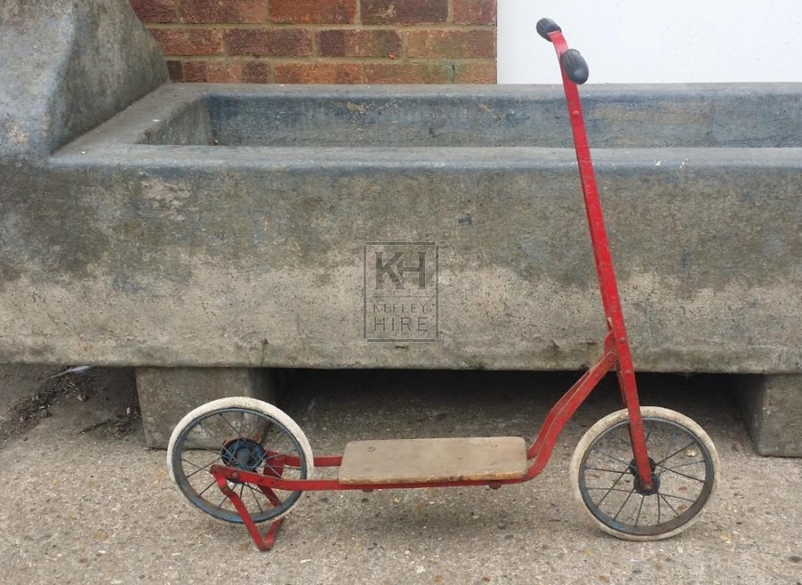 Red metal period scooter