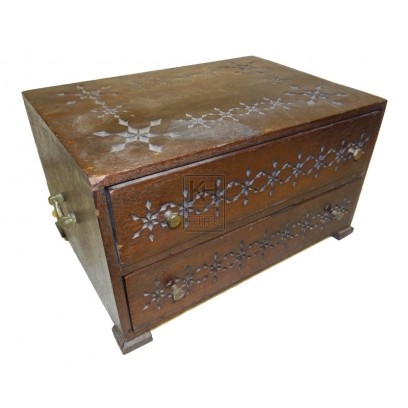 Dark wood carved chest with draws