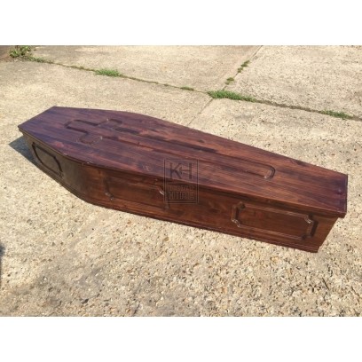 Dark carved wood coffin